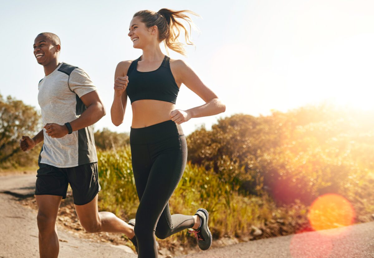 Shot of a fit young couple going for a run outdoors