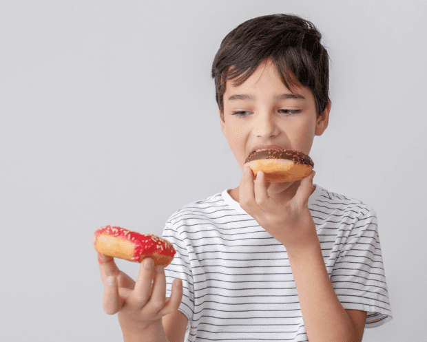 children eating sugary foods that are bad for their teeth and cause cavities