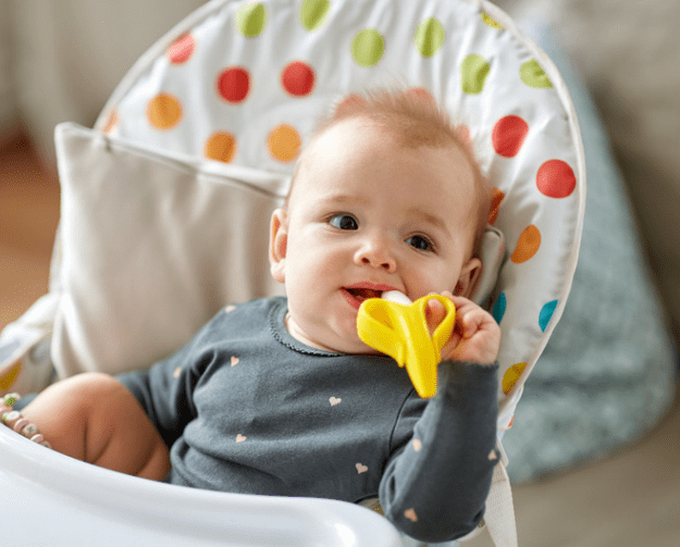 baby with a toy in mouth can get cavities