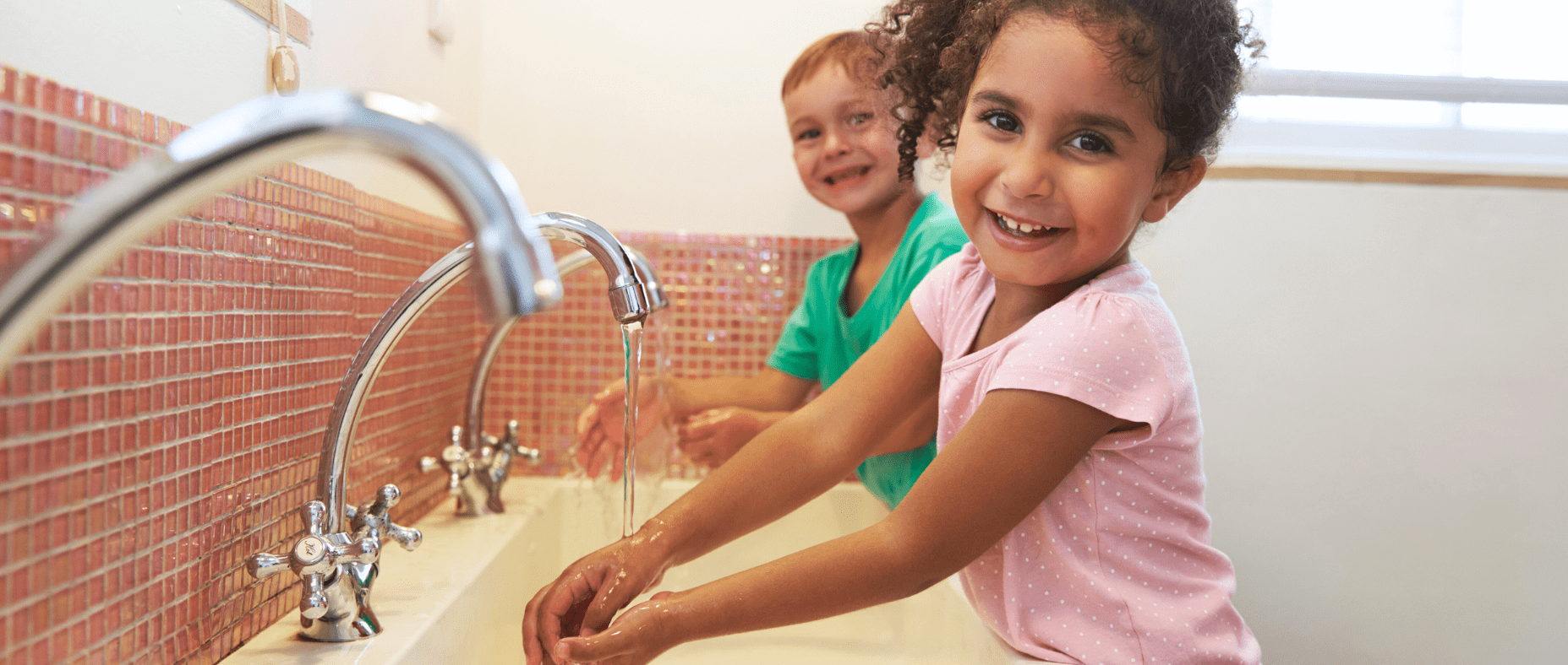 children learning to wash their hands at school