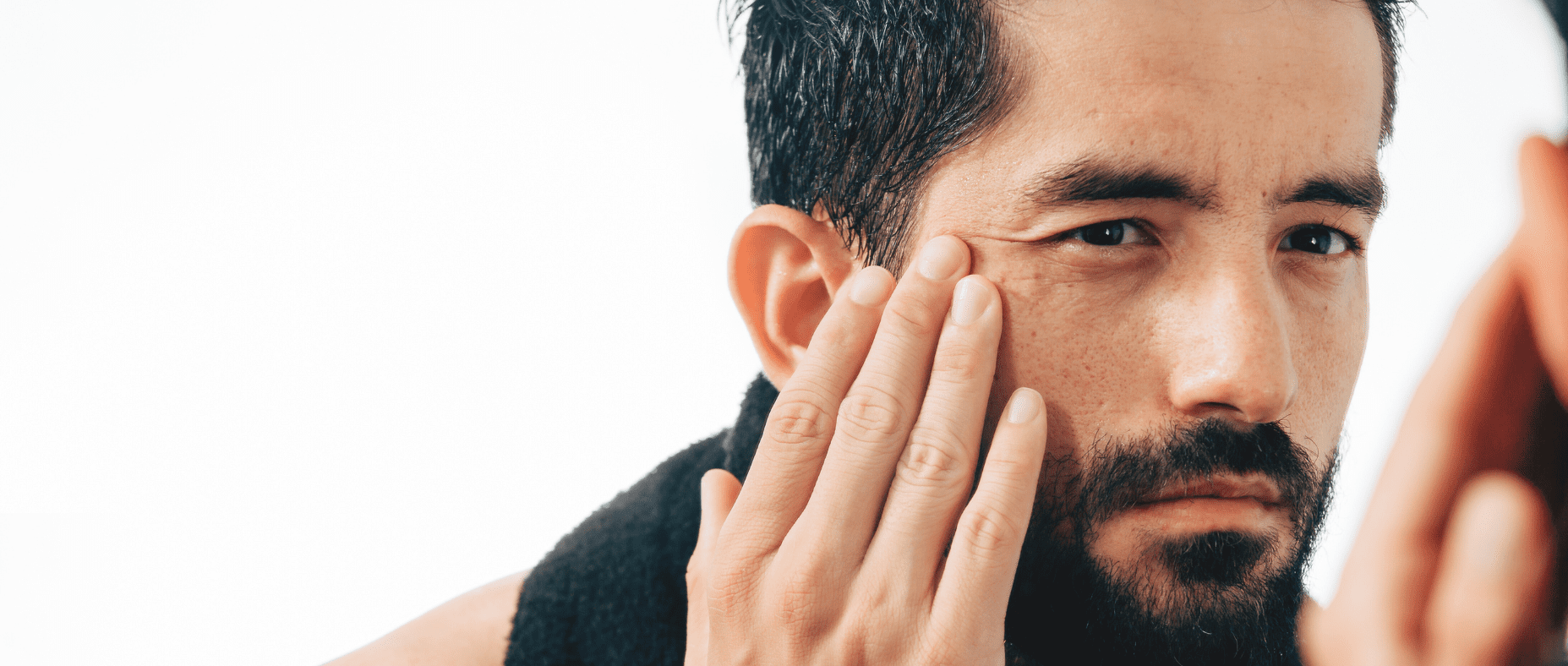 man watching wrinkles appear on his skin